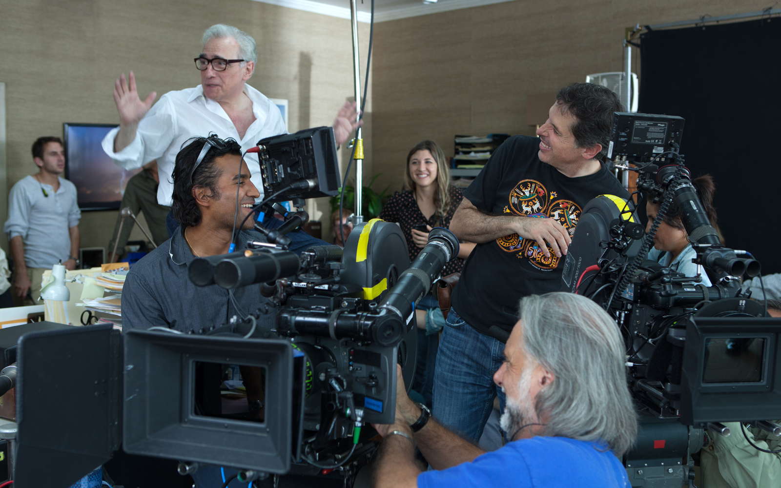 Scorsese chatting with his camera crew, on the set of 'The Wolf of Wall Street' (image: Paramount Pictures).