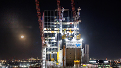 High-rise construction project photographed at night