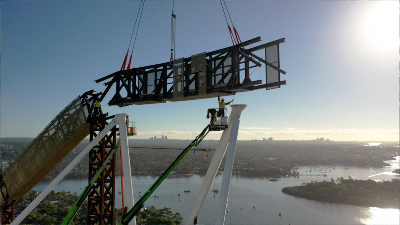 Huge steel beam being installed on high-rise.